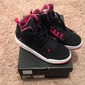 Black and pink flight Jordans